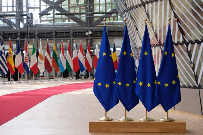 shutterstock_1825608365.jpg featured image EU flags and European flags on the background.