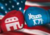Red and blue boxing gloves with political party symbols.