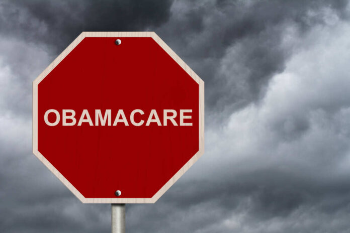 shutterstock_159663626.jpg featured image Red stop sign labeled Obamacare cloudy sky background