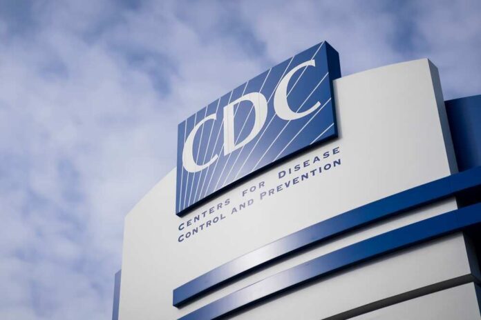 shutterstock_2123545061.jpg featured image CDC building sign against a cloudy sky.