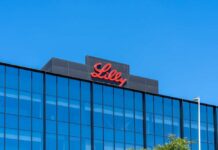 Lilly logo on a modern glass building rooftop