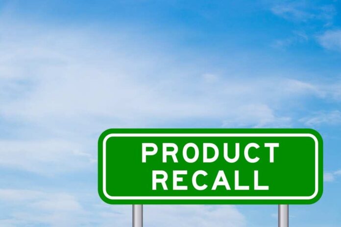 shutterstock_2182367505.jpg featured image Green sign with product recall text and sky background