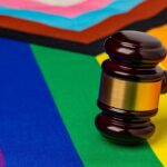 Gavel on rainbow and pride flags overlapping