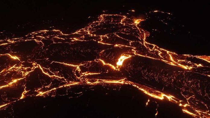 shutterstock_2345382701.jpg featured image Glowing lava flow at night forming intricate patterns