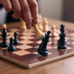 Person playing chess wooden pieces on board