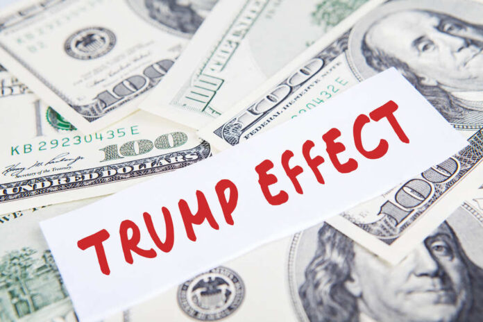 shutterstock_519205120.jpg featured image Text Trump Effect over hundred dollar bills