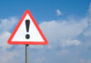 Triangular warning sign with exclamation mark