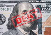 Hundred dollar bill with red debt stamp
