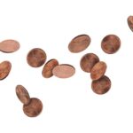Several scattered pennies on a white background