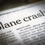Newspaper headline about a plane crash.