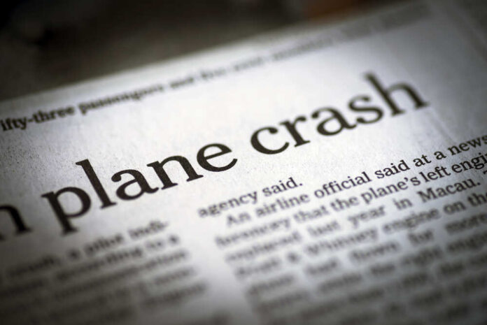 Newspaper headline about a plane crash.