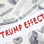 Text Trump Effect over hundred dollar bills