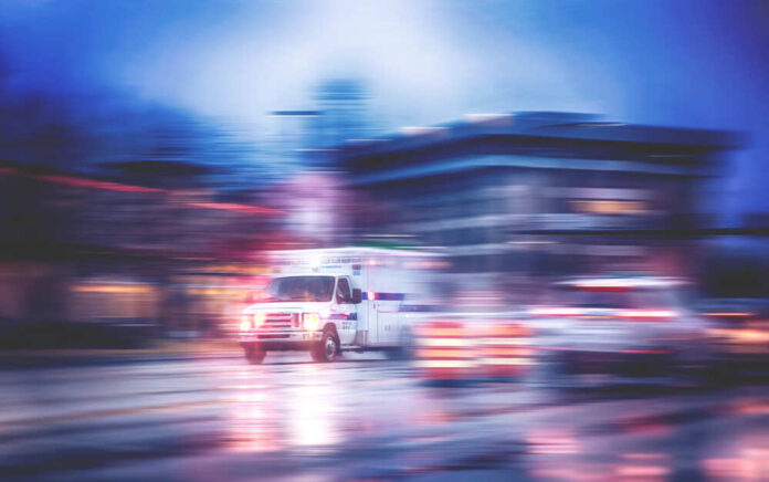 shutterstock_532768414.jpg featured image Ambulance speeding through city street at night