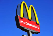 McDonalds logo on a pole clear sky