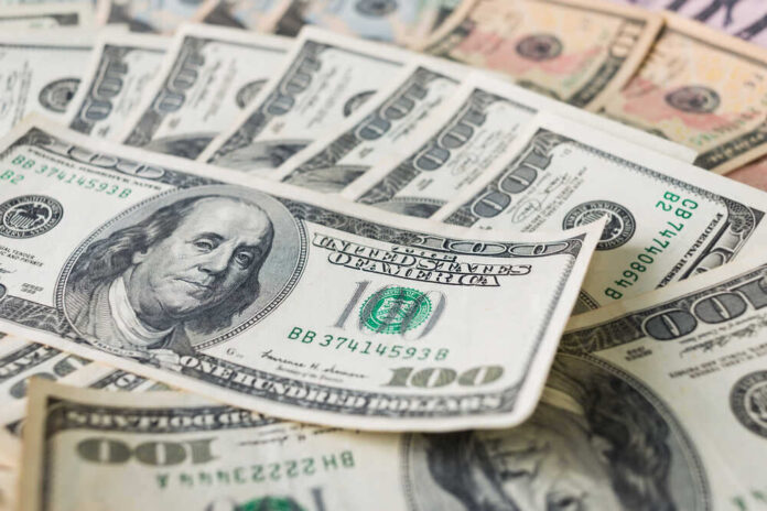 shutterstock_548542114.jpg featured image Stacks of various U.S. dollar bills.