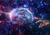 Hand reaching out to a digital brain simulation.