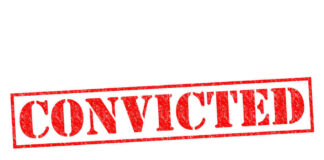Red stamped text convicted on white background