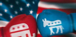 Red Republican glove and blue Democrat glove facing off