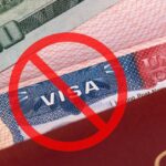 American visa with prohibition sign and money