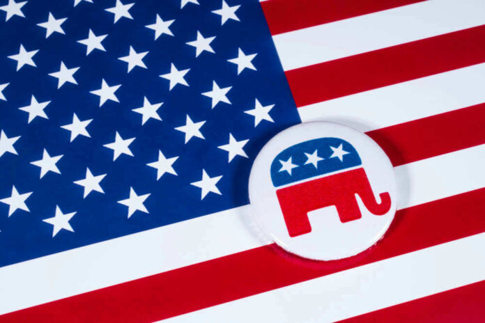 shutterstock_786450130.jpg American flag and Republican Party elephant logo button.
