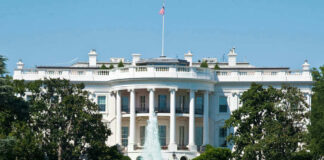 The White House, front view with fountain and flag