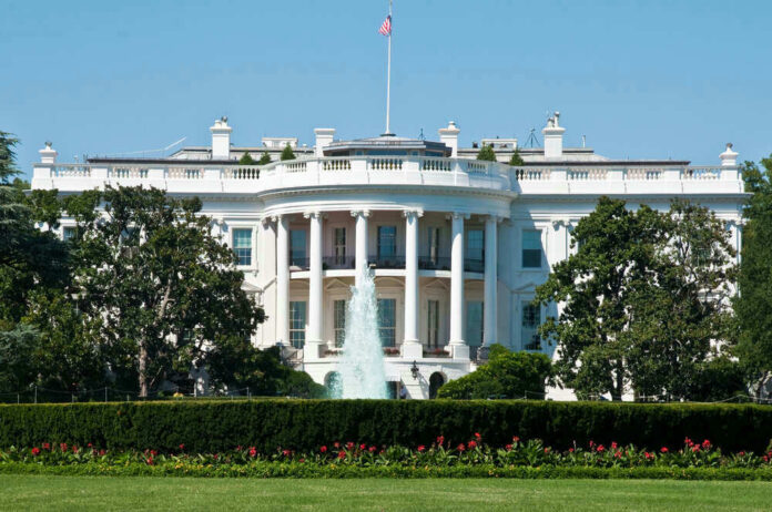 The White House, front view with fountain and flag