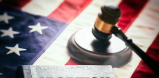 Book titled 'Abortion Law' with gavel and American flag