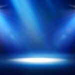 Empty stage with blue spotlights shining down