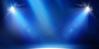Empty stage with blue spotlights shining down