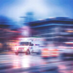Ambulance speeding through city street