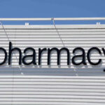 Sign for a pharmacy on a building