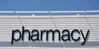 Sign for a pharmacy on a building