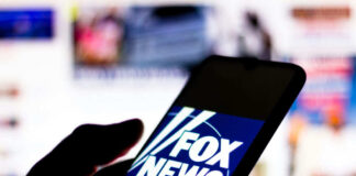 Smartphone showing Fox News logo on screen