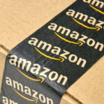 Close-up of an Amazon-branded shipping box tape on a cardboard box