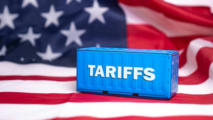 shutterstock_2593025849.jpg Shipping container reading tariffs on the American flag
