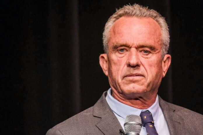 Robert F. Kennedy JR holding microphone.