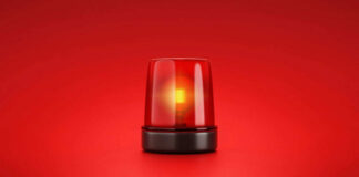 Red emergency light on red background