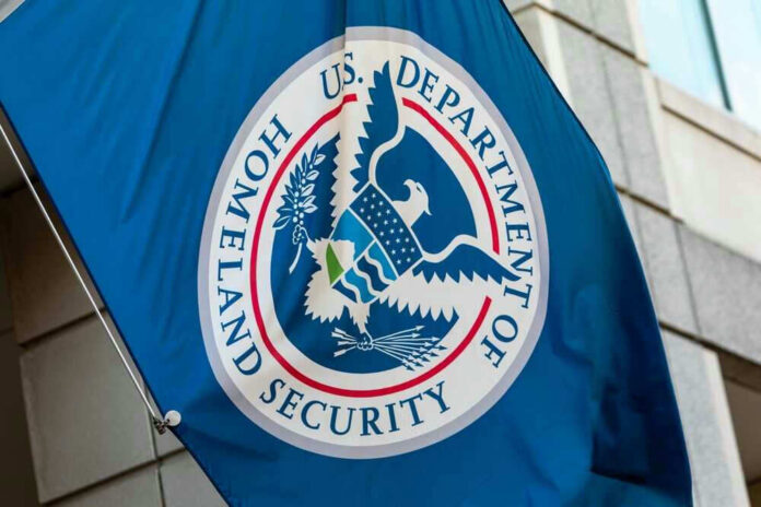 U.S. Department of Homeland Security flag on building.