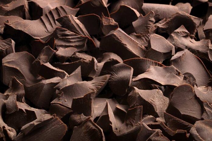 Close-up of dark chocolate shavings scattered on a surface