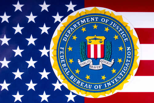 FBI seal overlaid on an American flag background