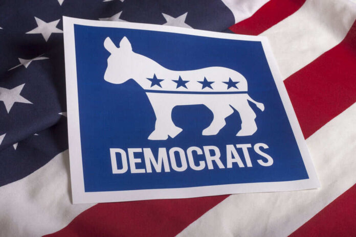 Democrats logo on American flag background.