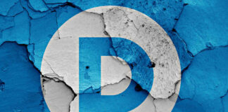 Democratic Party logo on a cracked, peeling surface.