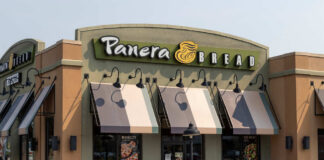 Exterior view of a Panera Bread restaurant with outdoor seating
