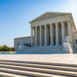 United States Supreme Court building exterior, sunny day.