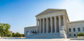 United States Supreme Court building exterior, sunny day.