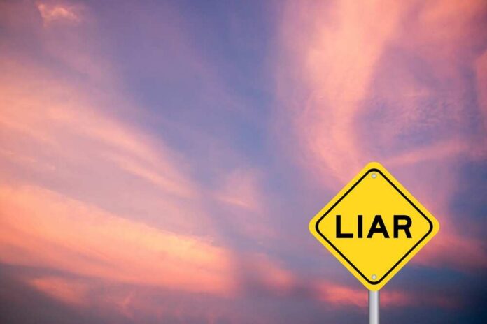 A yellow warning sign with the word 'LIAR' against a colorful sky