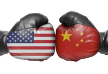American and Chinese flag boxing gloves facing off