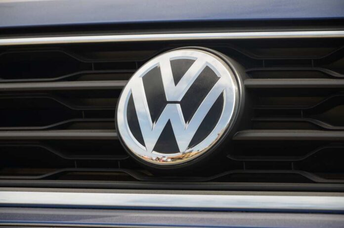 Close-up of a Volkswagen logo on a car grille