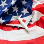 A model airplane placed on an American flag