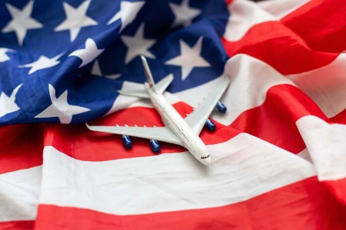 shutterstock_2358962125.jpg A model airplane placed on an American flag